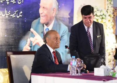 Anwar Masood seated on stage at Jacaranda Family Club members event